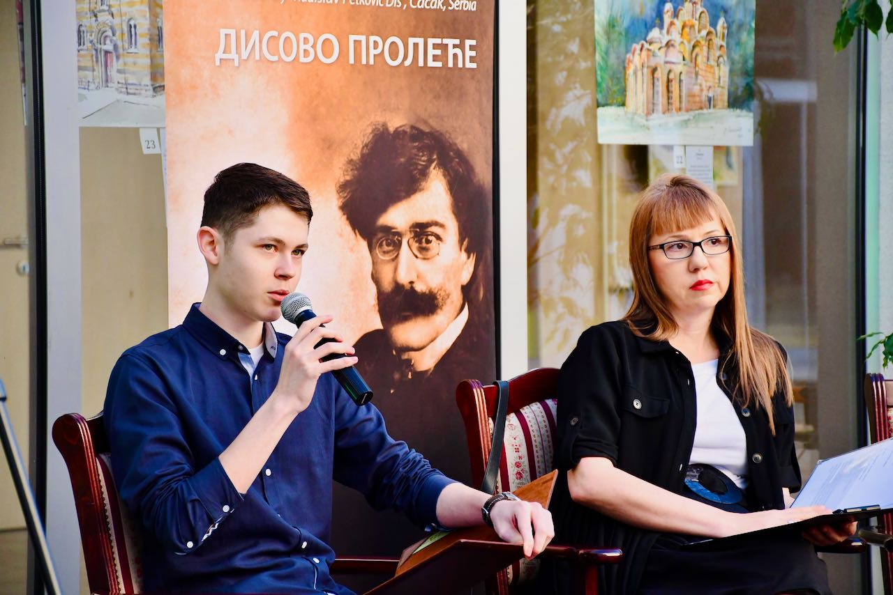 Greenwood reciting poetry at Disovizija, 2025